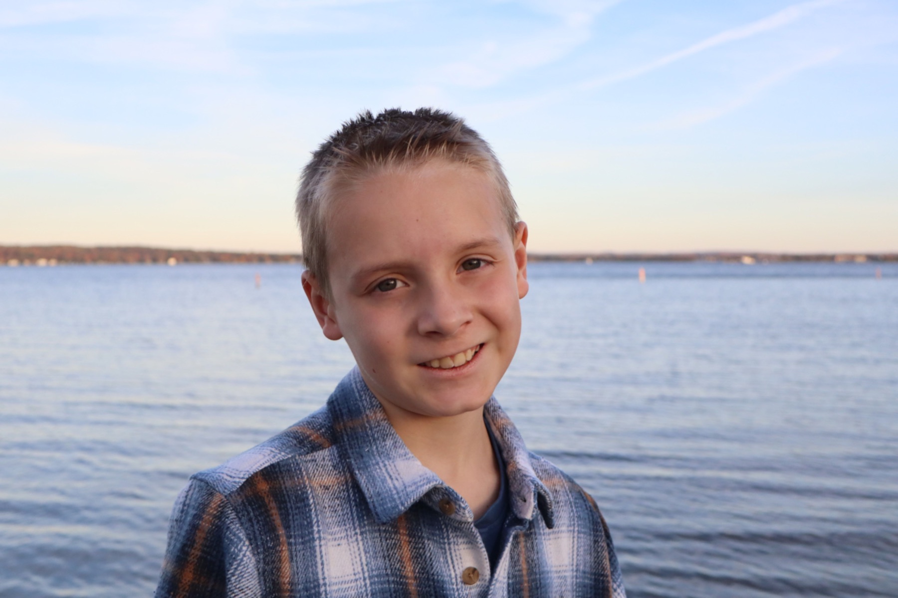 Child portrait beside a lake by Patrick’s Photography